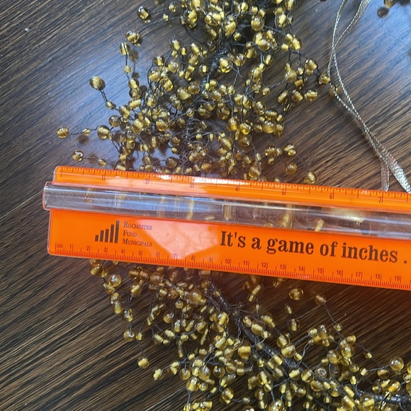 Gold bead wreath on metal frame. Diameter frame 10.5 inches. Beads stretch to 15 - Picture 9 of 12